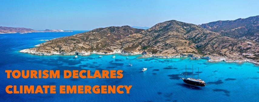 A logo with the words "Tourism Declares A Climate Emergency" on a greek rocky island background
