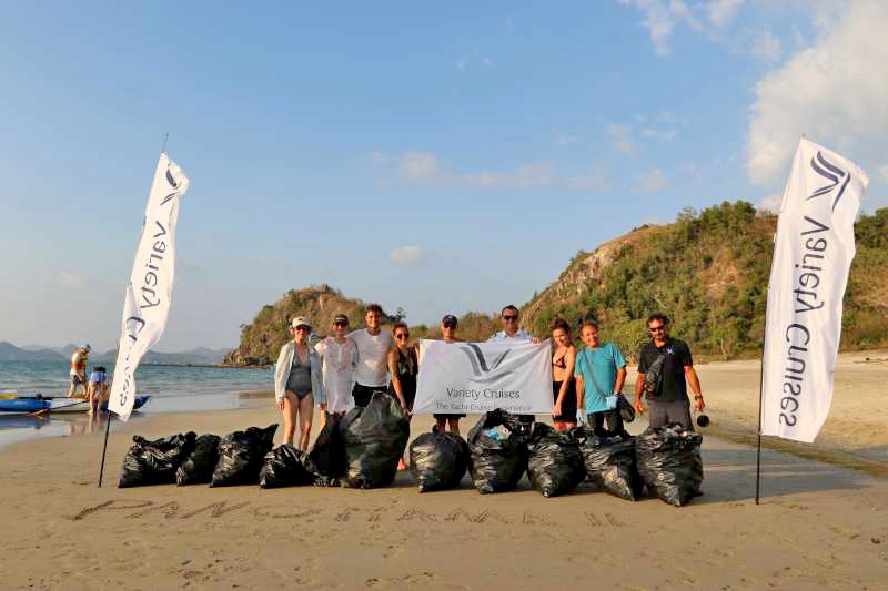 A group of people cleaning up a beach