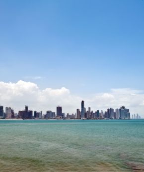 View to city with skyscrapers next to the sea