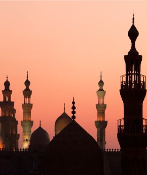 View of Cairo temples with the sunset in the background