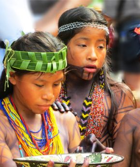 Local children wearing traditional clothes and painted with colours