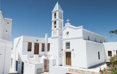 Traditional greek white houses and church in greek islands