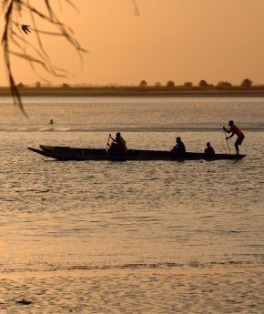Local people in a boat in West Africa