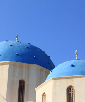 A view of the whitewashed church on a Greek island