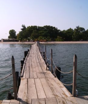 View of a woden brigde to a tropical island
