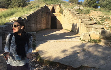 A tourist in front of the ancient tomp of Atreas