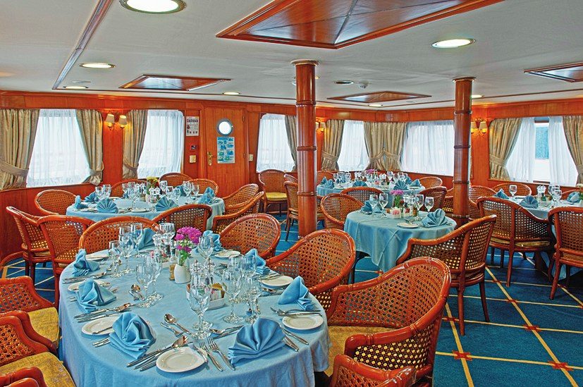 Indoor dining area on the Callisto with Variety Cruises