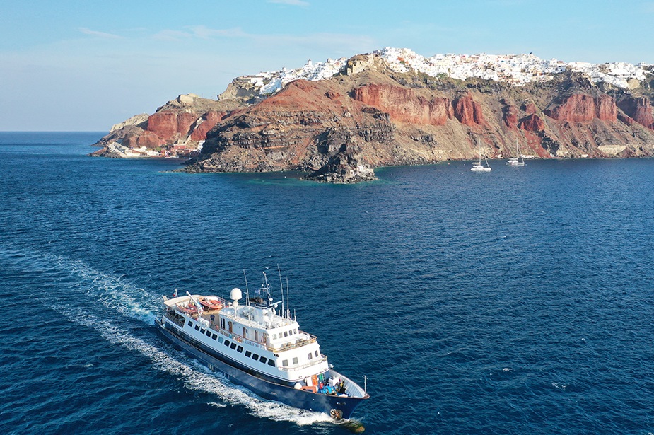 Premium Photo  Greek flag on boat cruise around the island of