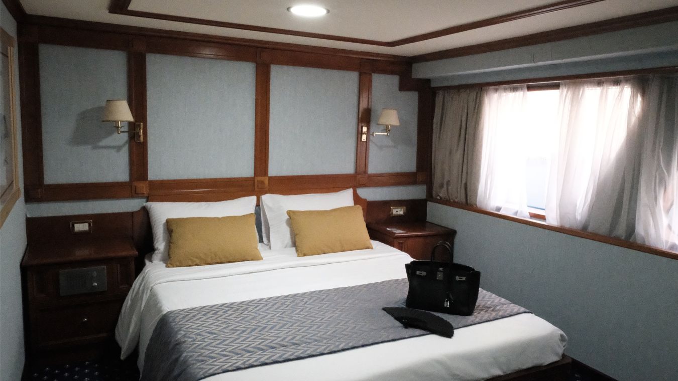Callisto Yacht Cabin with a Double Bed and Large Window