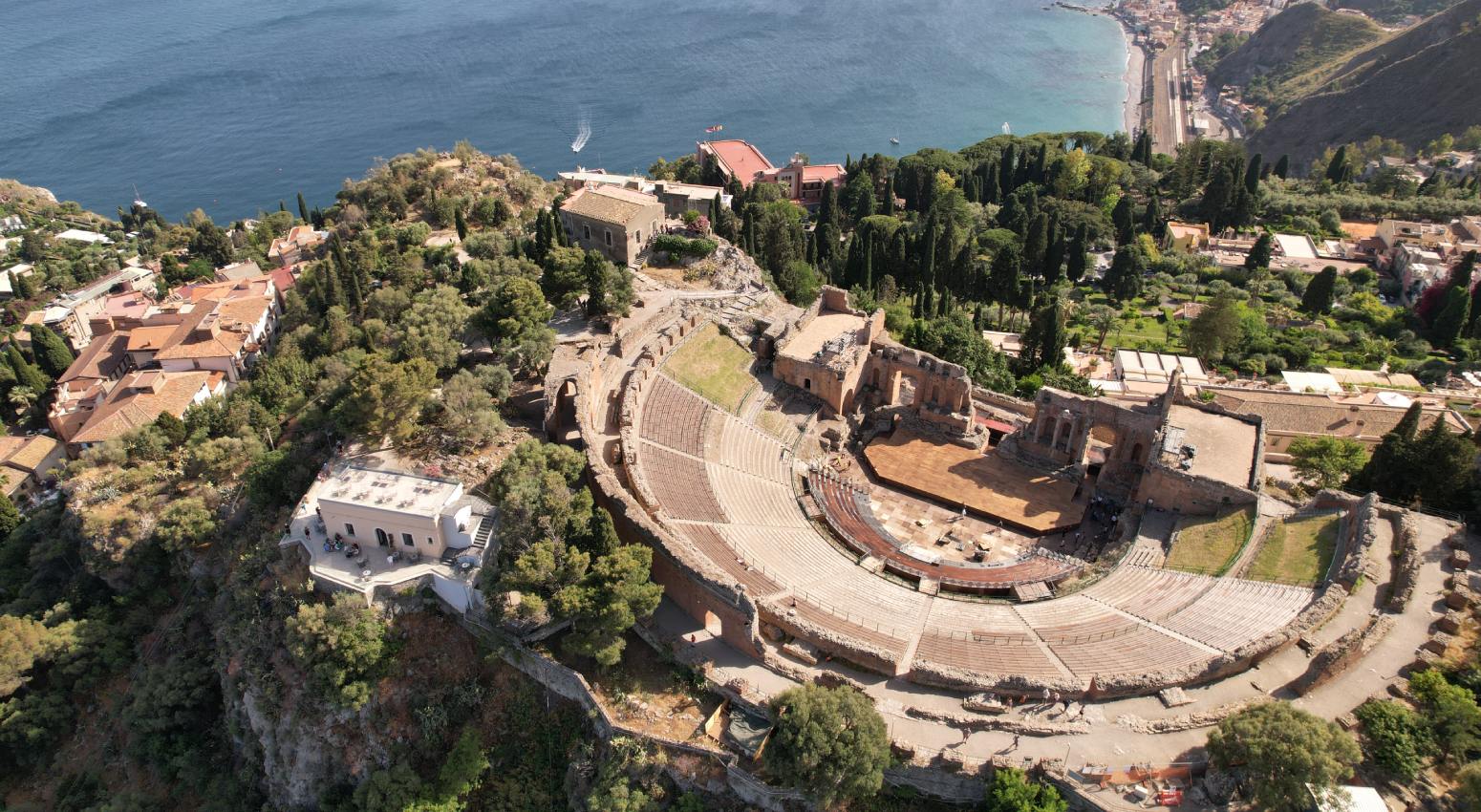 Aerial view of an ancient theatre next to the sea