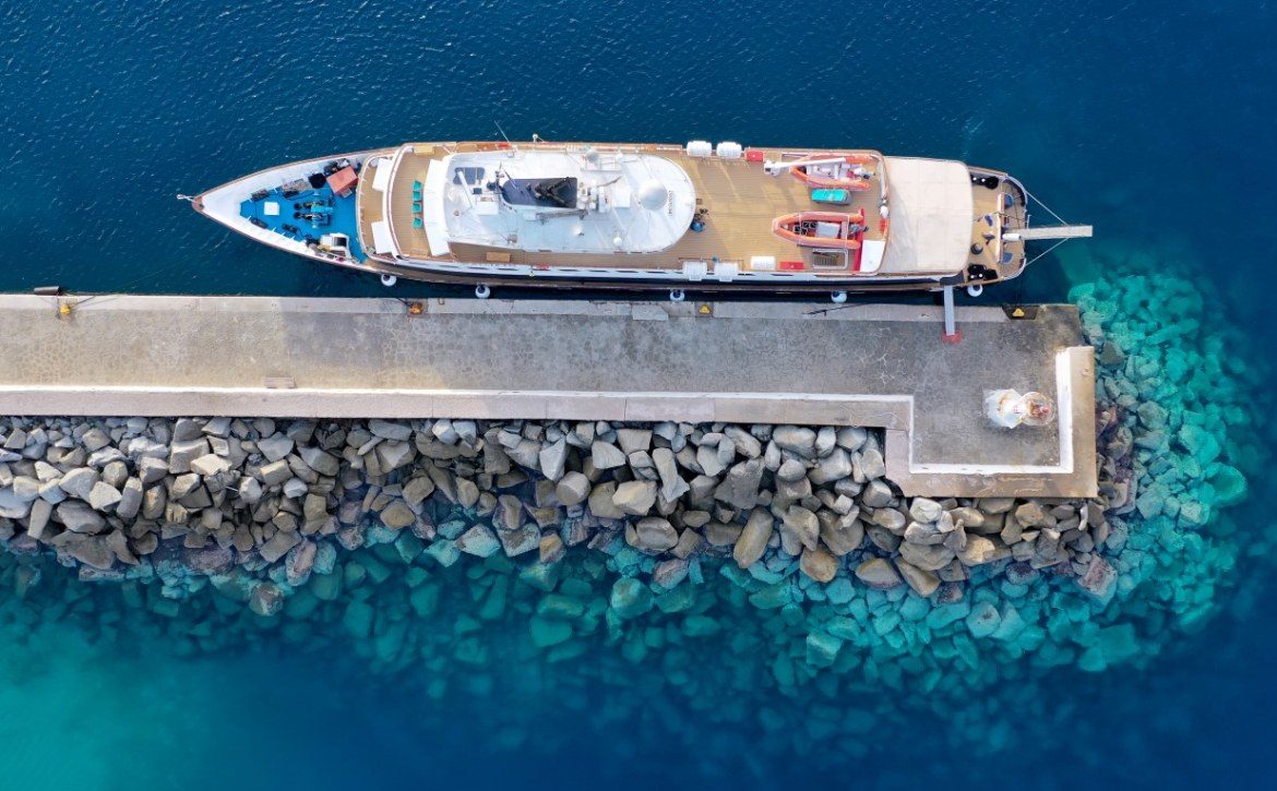 Aerial view of a Variety Cruises' shop anchored at a jetty