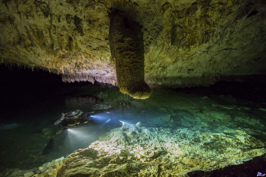 Inside a cave with turquoise waters