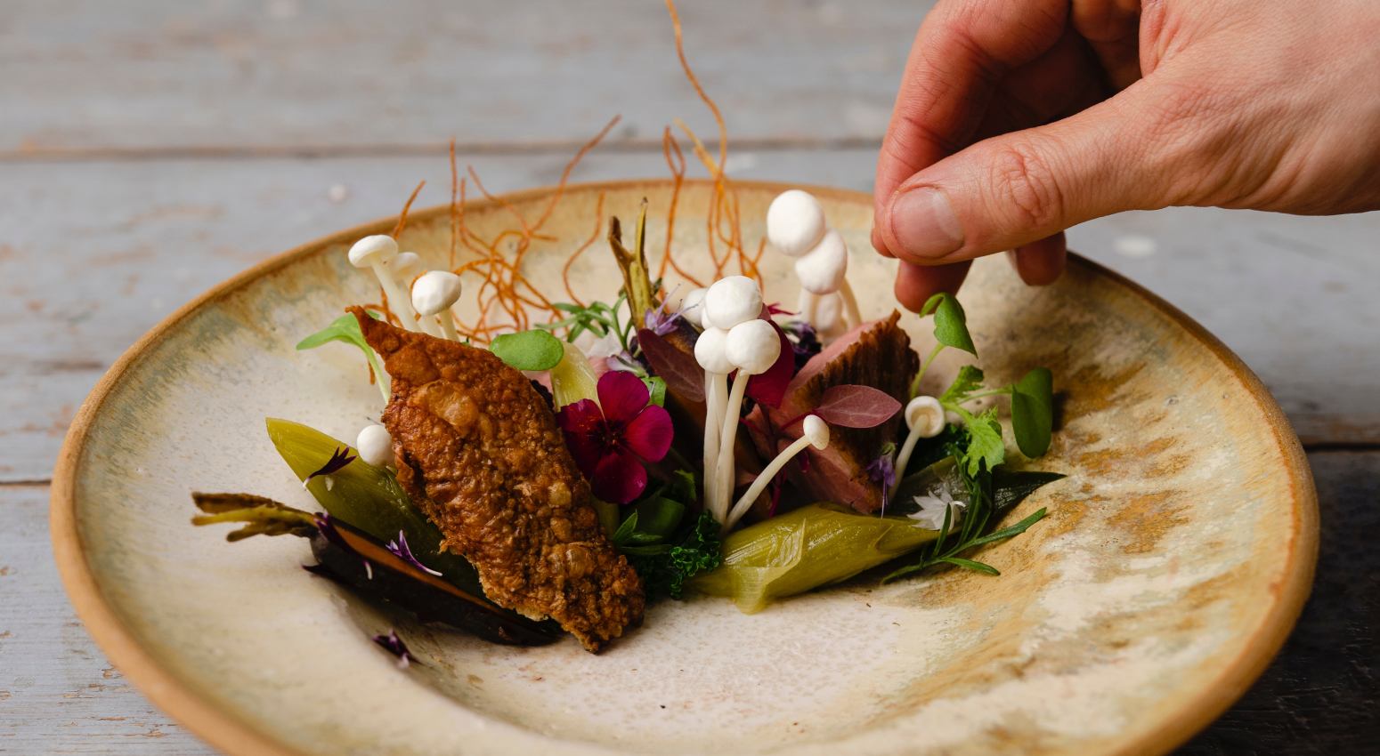 A close-up of a dish of seafood and vegetables