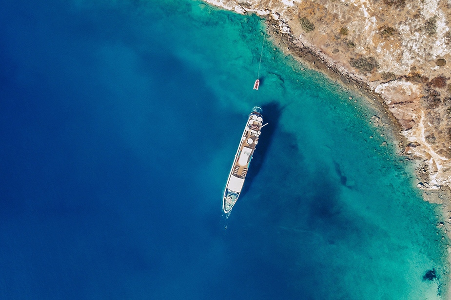 Harmony ship anchored in a rocky beach