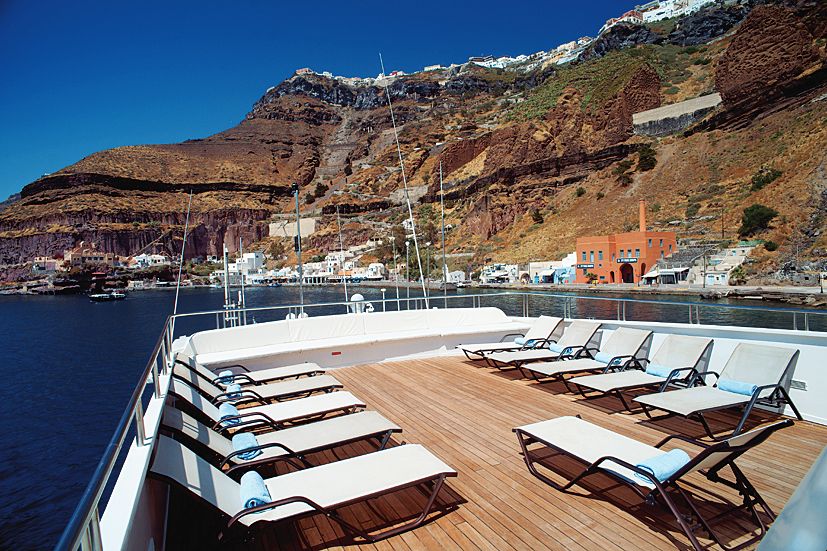 The sun deck on the Harmony G cruise ship with lounge chairs