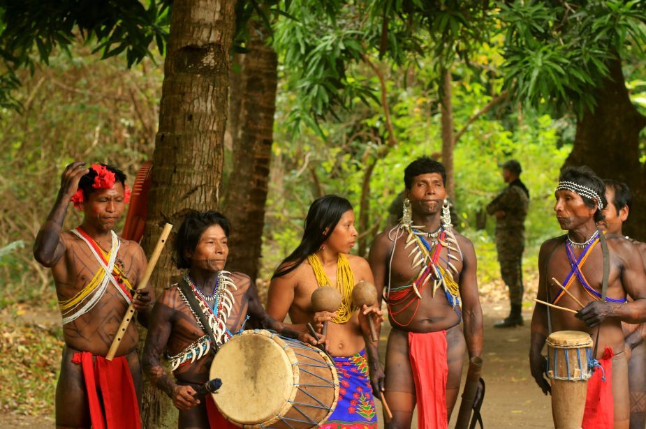 Locals with traditional clothings, playing music