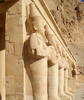 A view of Luxor Temple with statues and columns