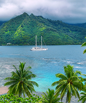 Variety Cruises' ship travelling with tropical islands on the background