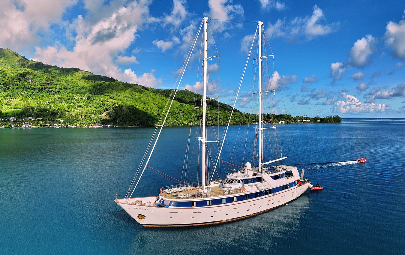 Variety Cruises' ship travelling with tropical islands on the background