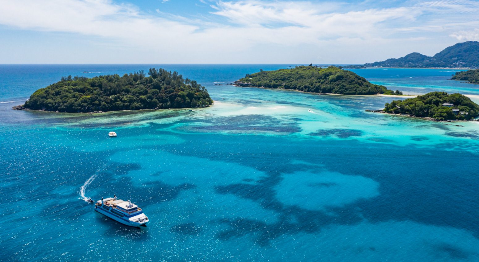 Boat sailing to tropical islands