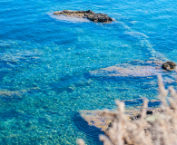 Turquoise waters and rocks in Ionian sea, Greece