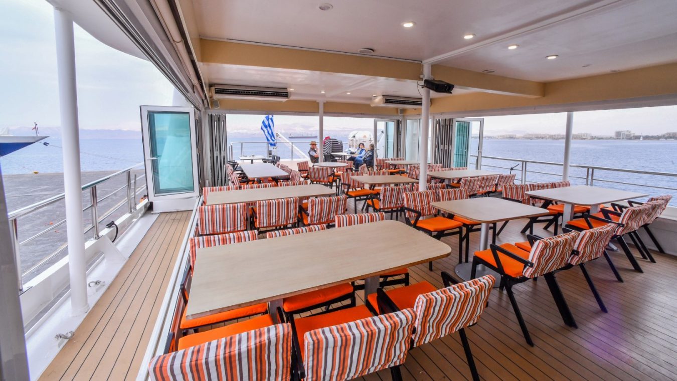 Upper deck dining and lounge area on a Variety Cruises small ship