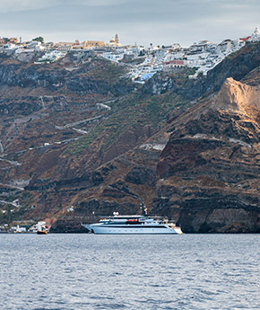 Variety Cruises' ship floating in front of the caldera in Santorini Island