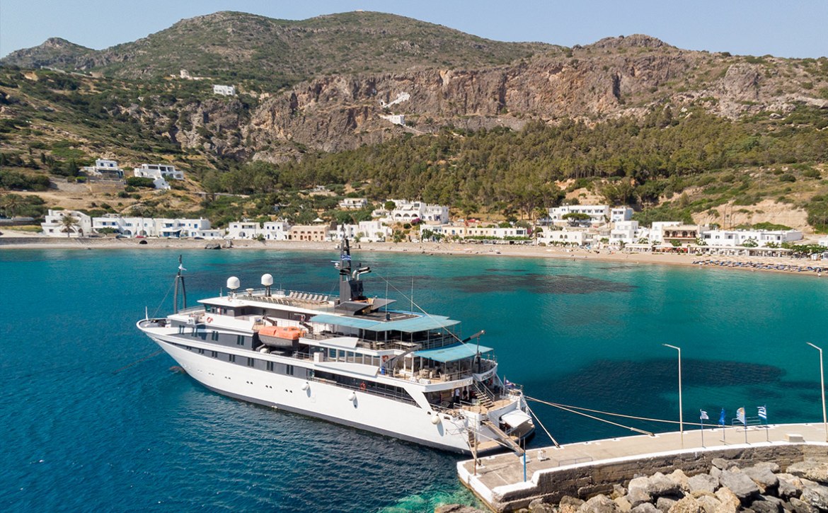 Voyager a Variety Cruises ship anchored in an island