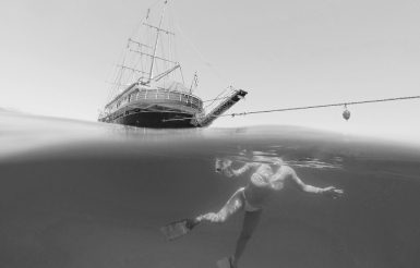 Underwater photo of Galileo yacht anchored in the serene waters of the Cyclades