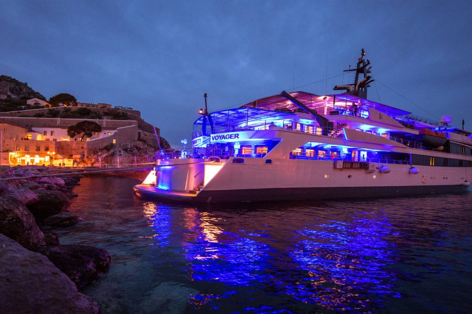 Small ship in a port at night