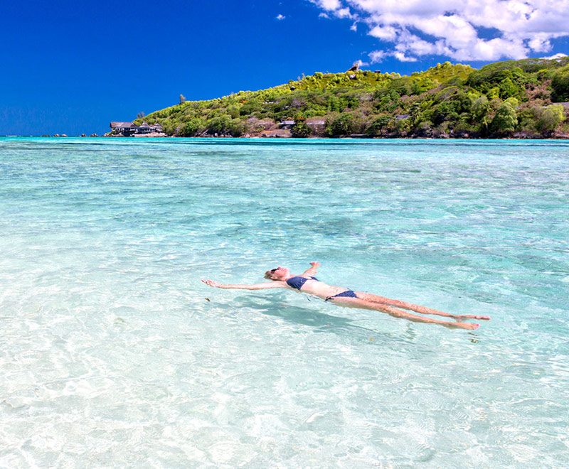 A woman swimming in the turquoise sea