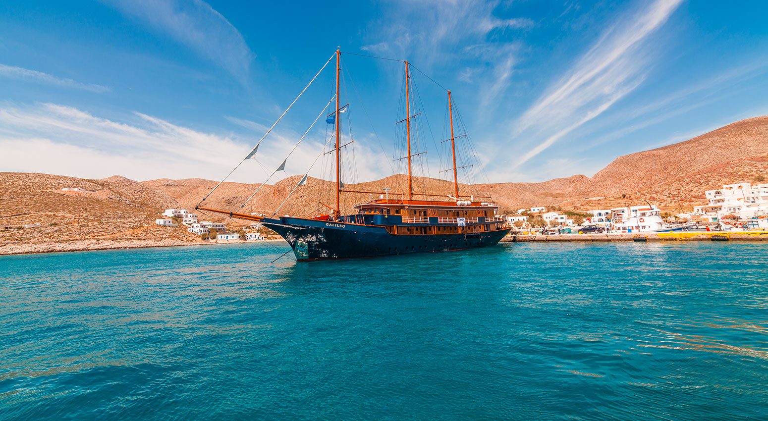 A small luxury yacht sailing in the Greek islands, part of Variety Cruises' last-minute offers