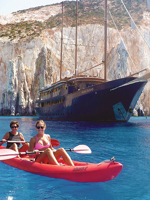 People canoeing at the sea with Variety Cruises for small boat cruises