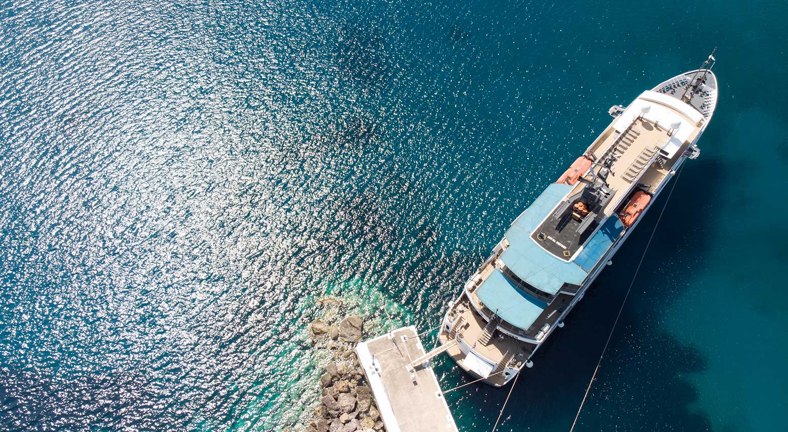 Variety Voyager small cruise boat anchored