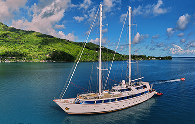 Variety Cruises' ship in the sea with an island on the background