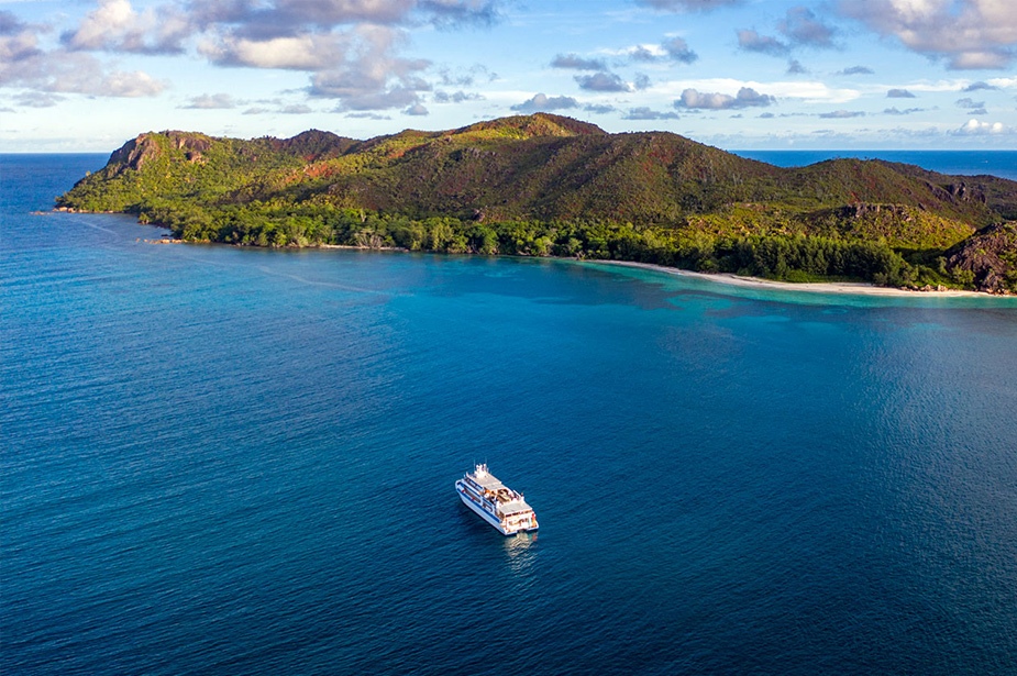 Variety Cruises' ship floating with an island on the background