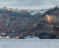 Variety Cruises' ship floating in front of the caldera in Santorini Island