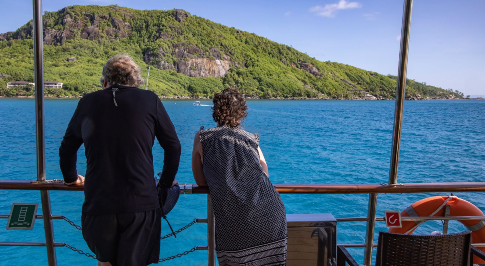 A couple enjoying the view during a cruise.