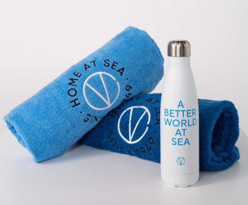 Products of Variety Cruises home edition "home at sea". Image with two towels and a bottle
