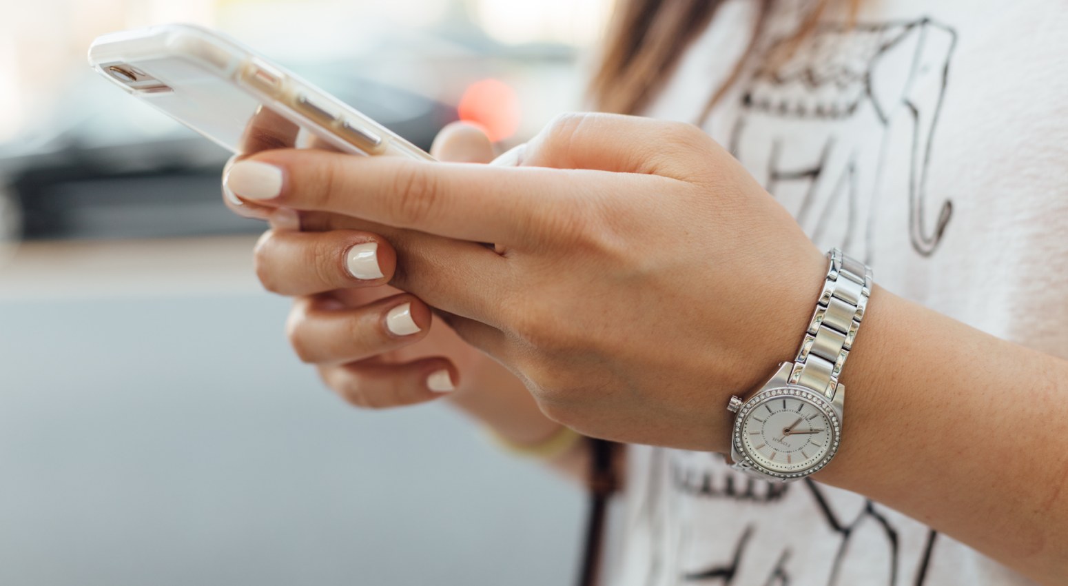 Woman checking her smartphone on a cruise ship.