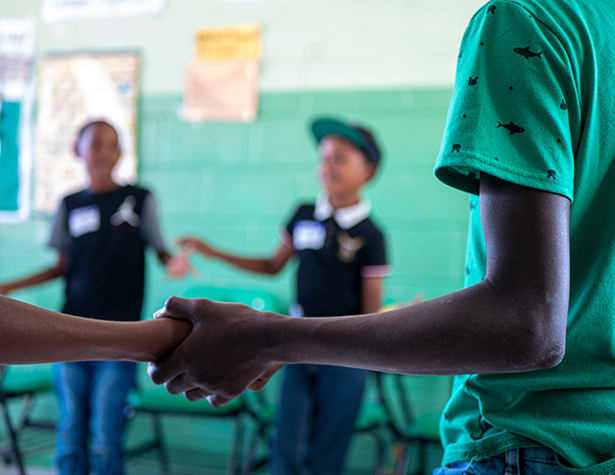 Kids holding their hands