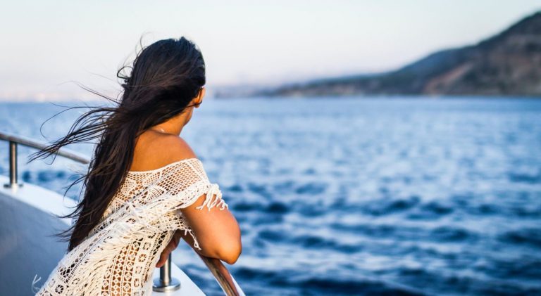Woman enjoying the view during a cruise.