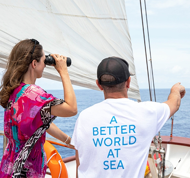 A Variety Cruises' member with a tourist on the deck