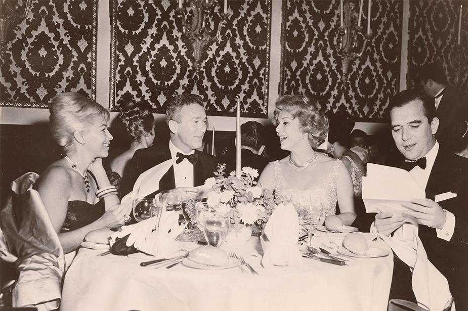 Old photo of people dining on board
