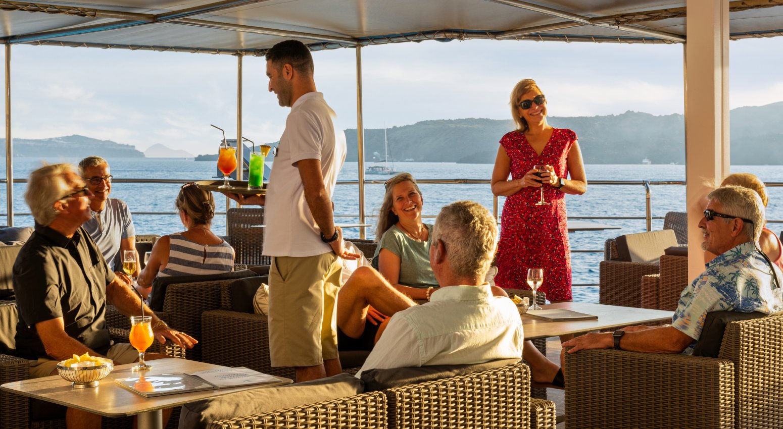 People enjoying their drinks during a cruise