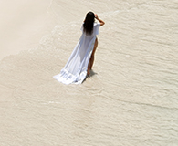 Woman walking on a sandy beach