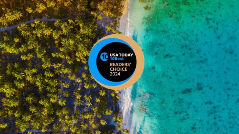 Aerial view of the turquoise waters and palm trees with USA today 10best readers choise 2024 logo