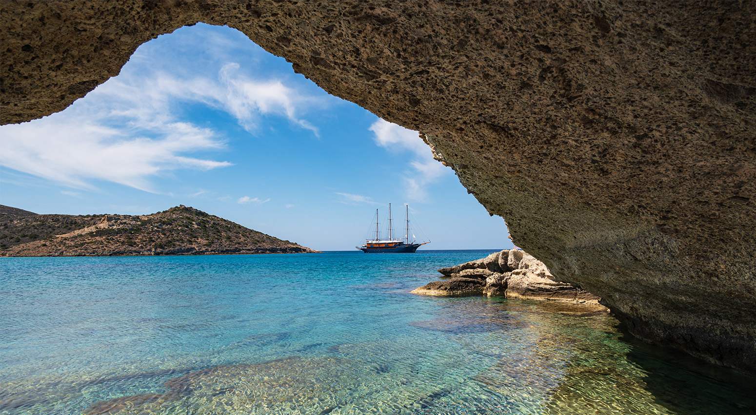 View of a cruise ship from a cave